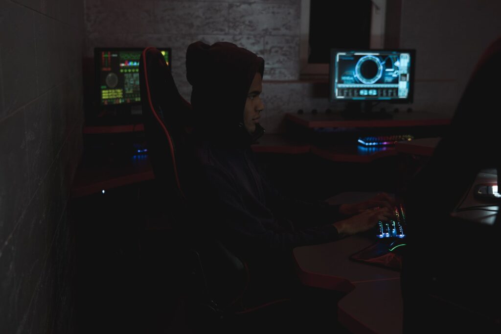 man in black hoodie using a computer