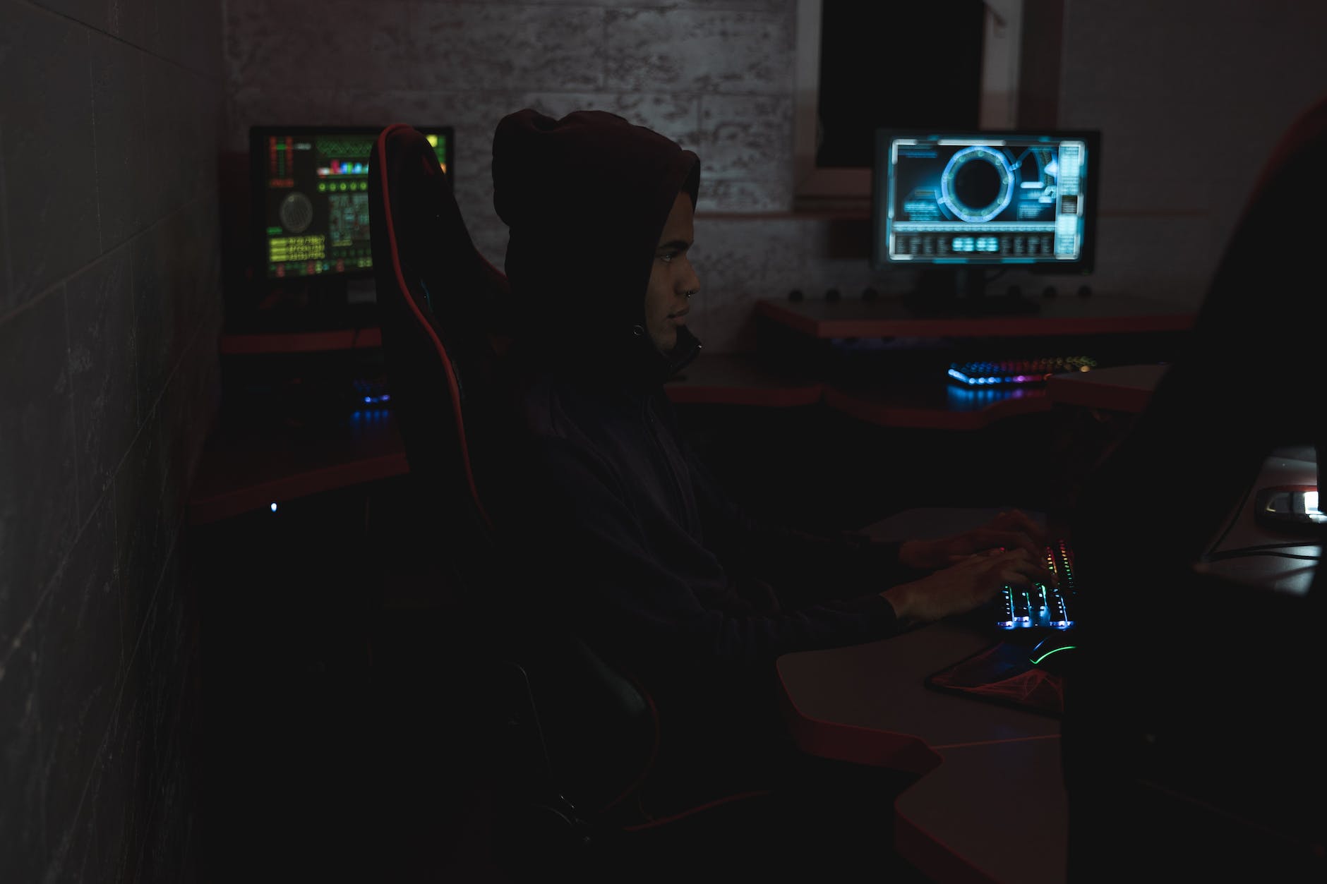man in black hoodie using a computer
