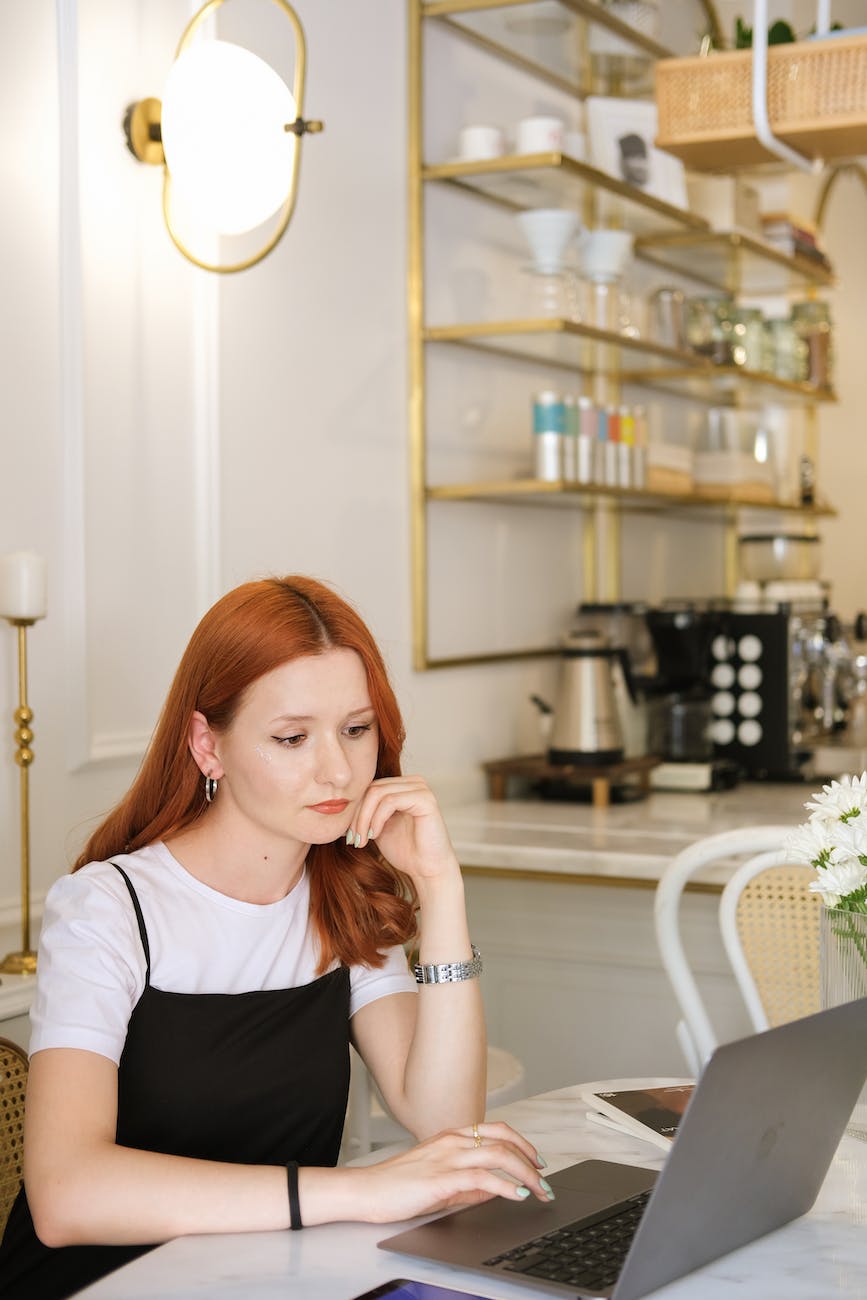 ginger head women working in a coffee shop